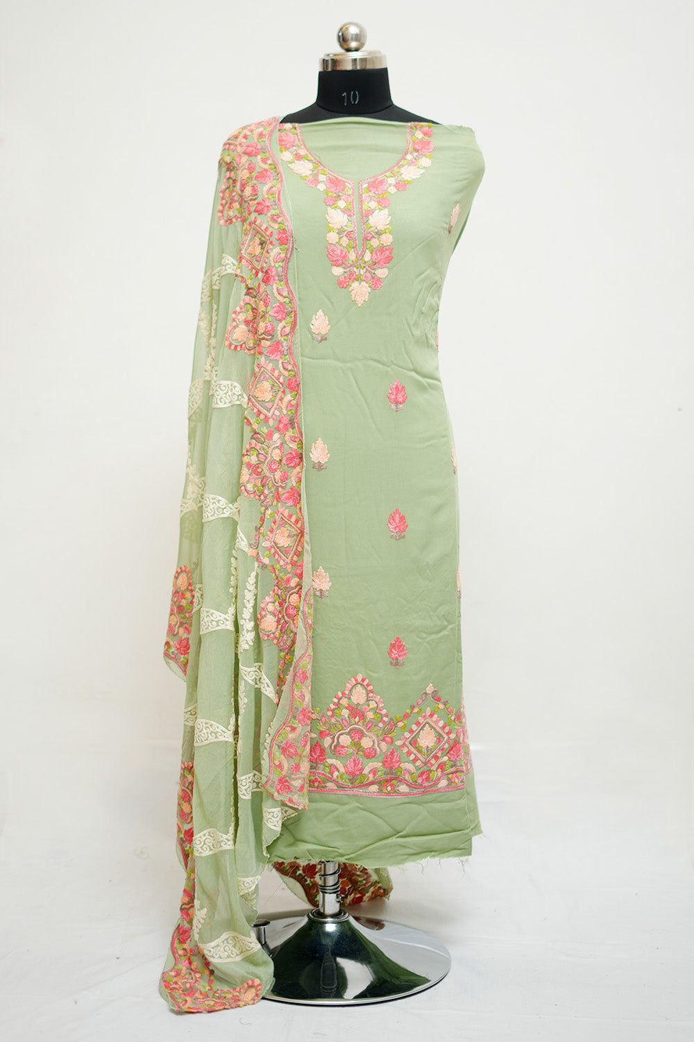 Pista green aari work salwar kameez with neckline pattern Pista green aari work salwar kameez with neckline pattern
