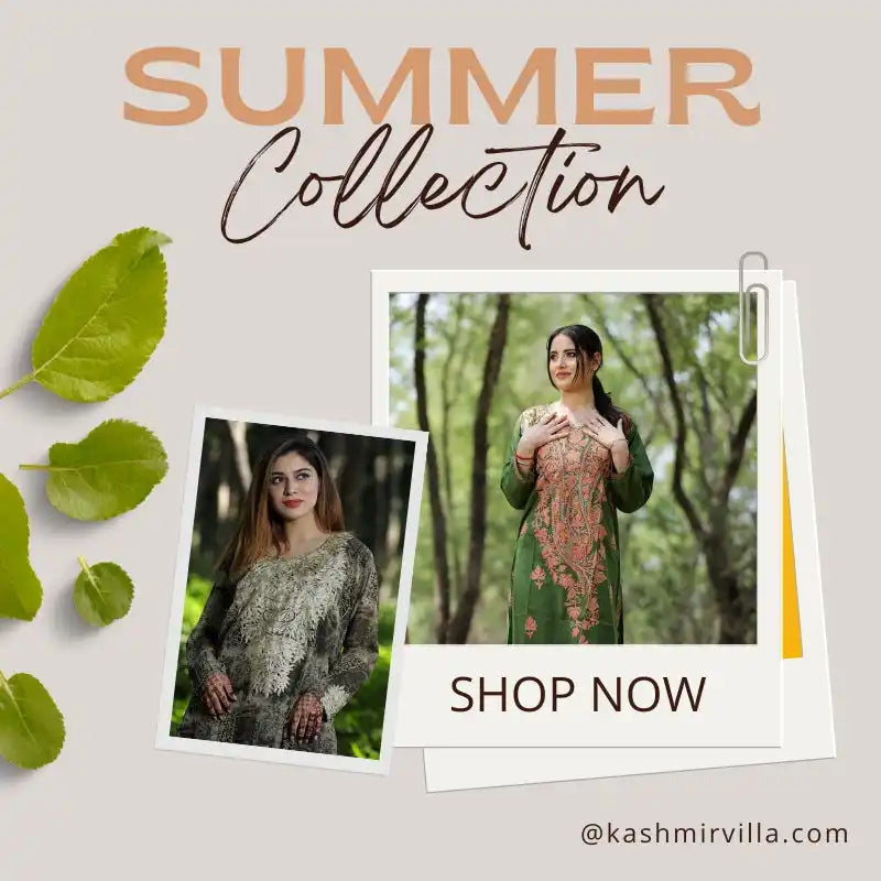 Two women modeling intricately embroidered traditional clothing.