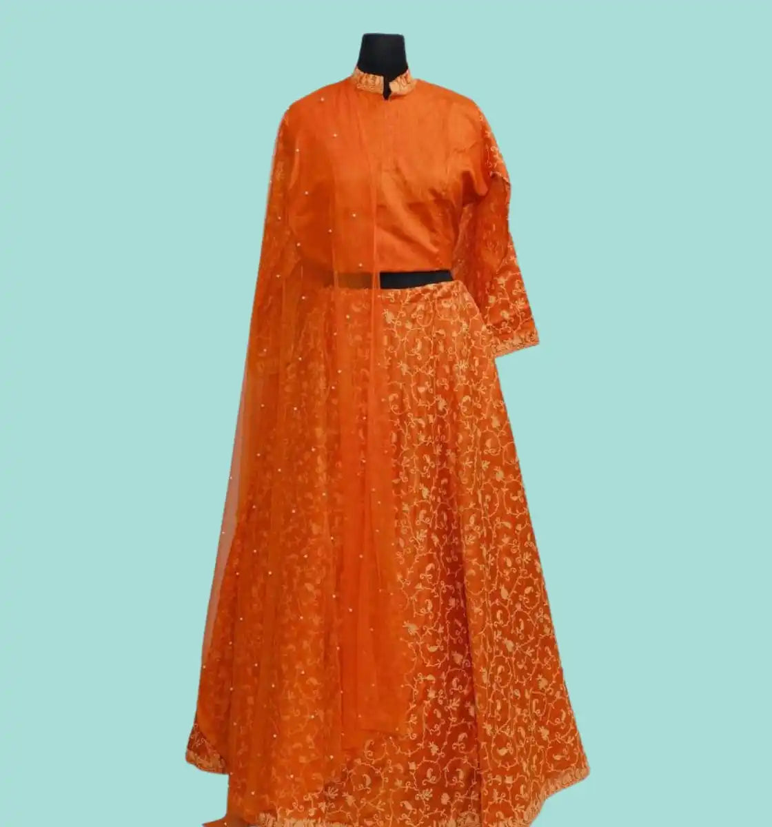 Orange embroidered lehenga choli with a matching dupatta.