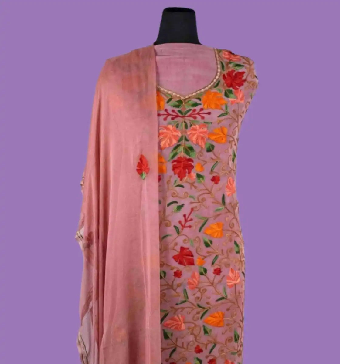 A pink embroidered kurta with a matching dupatta.